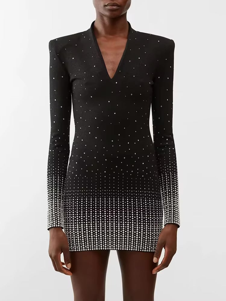 Abito con applicazioni in strass