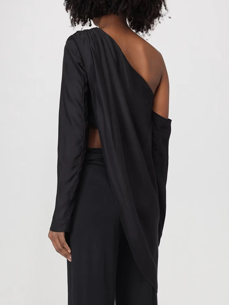 Maglia asimmetrica con drappeggio tessuto lucido